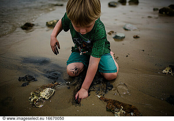 Six Year Old Boy Playing in Sand on Coronado Bay