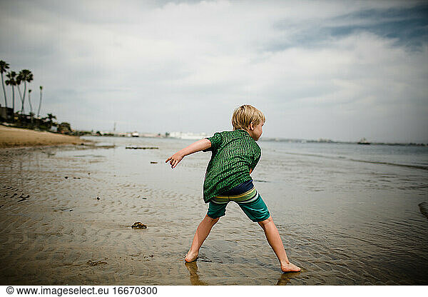 Six Year Old Boy Skipping Rocks in Coronado Bay