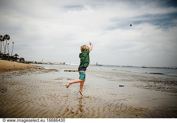Six Year Old Boy Skipping Rocks in Coronado Bay