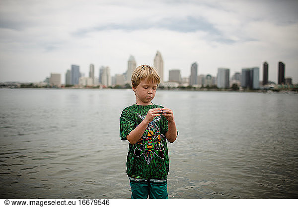 Six Year Old Boy Standing in Coronado Bay San Diego Skyline