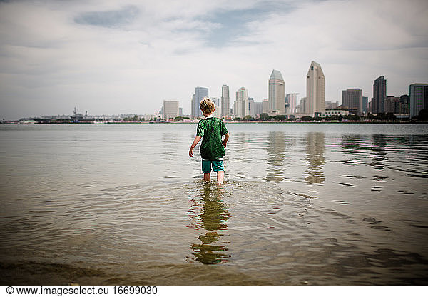 Six Year Old Boy Wading into Coronado Bay San Diego Skyline