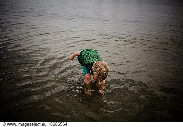 Six Year Old Standing & Reaching into Coronado Bay