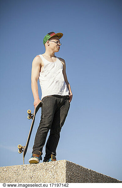 Skateboarder outside on sunny day