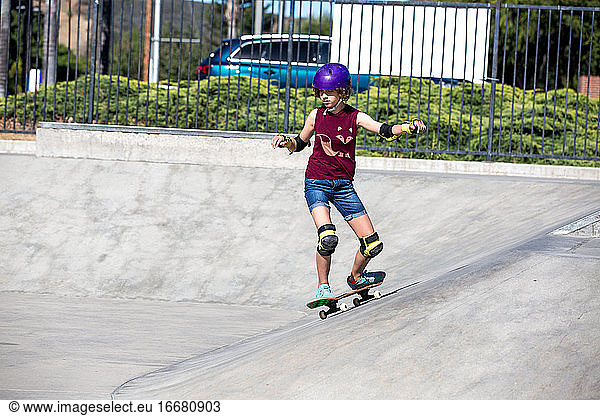 Skater girl carves at the skatepark