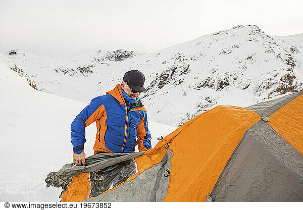 Ski mountaineer and explorer  Adam Palmer  enters tent