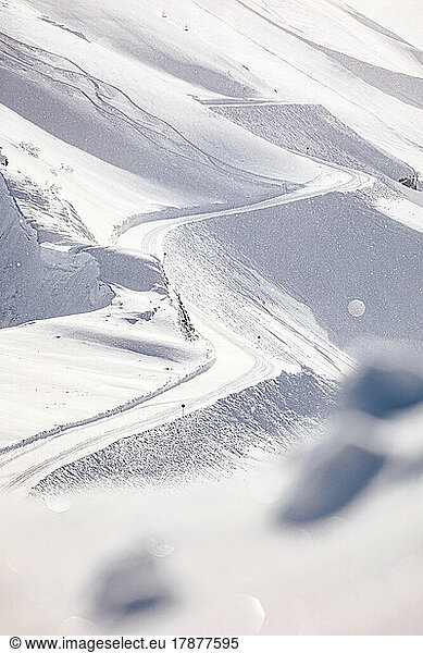 Ski tracks in snow on sunny day