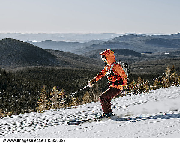 Skier speeds down slope on Baldface Mountain  New Hampshire