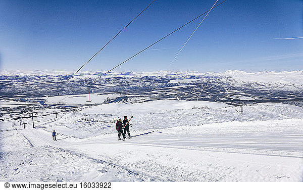 Skiers on a ski-lift in Vasterbottens Lan  Sweden.