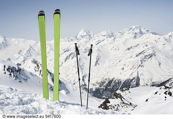 Skies poles Alps mountain peak blue sky nobody