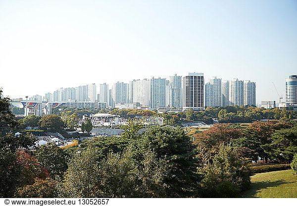 Skyline in daytime  national park in foreground  Seoul  South Korea