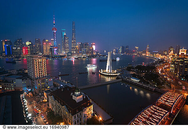 Skyline of the Pudong Financial district across Huangpu River at dusk  Shanghai  China.
