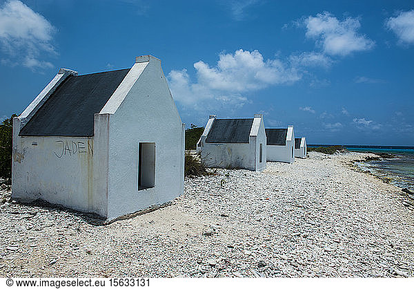 Slave huts at beach against blue sky in Bonaire  ABC Islands  Caribbean Netherlands