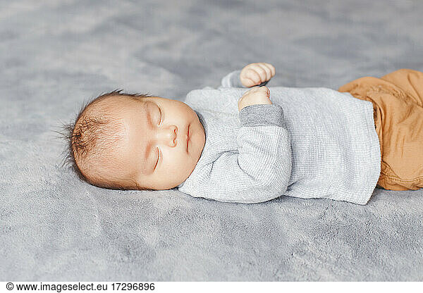Sleeping Asian Chinese newborn baby boy child. Healthy lifestyle