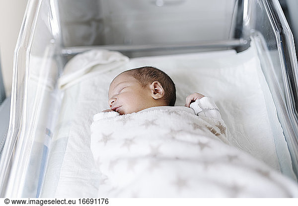 Sleeping baby lying in crib