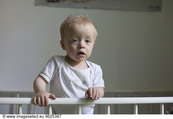 Sleepy little boy in his cot Sleepy little boy in his cot,people ...