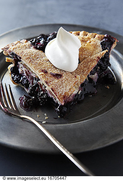 Slice of Blueberry Pie with Whip Cream