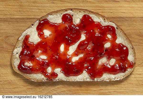 Slice of bread with jelly  elevated view