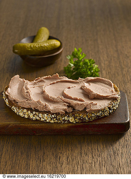 Slice of bread with liverwurst and parsley  close-up