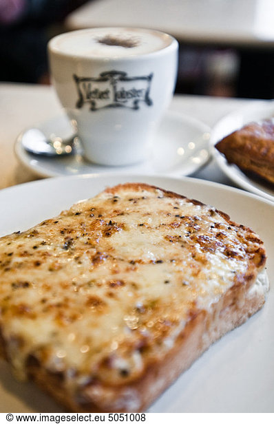 Slice of cheese on toast in cafe