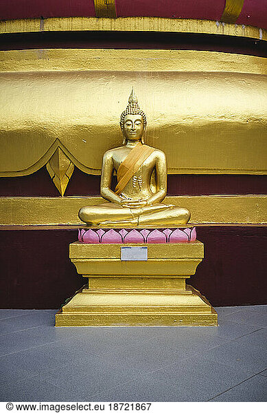 Small Golden Buddha Statue at a Local Temple in Thailand