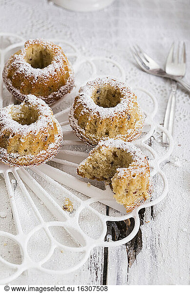 Small nut ring cakes on cake stand,  studio shot