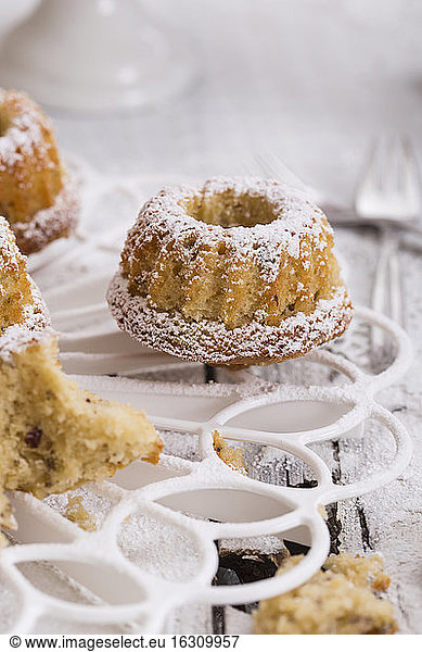 Small nut ring cakes on cake stand  studio shot