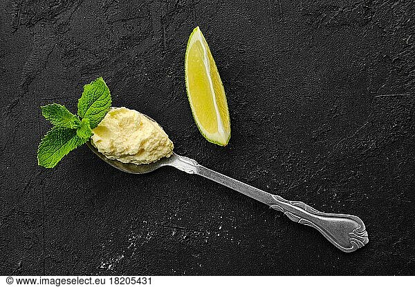 Small spoon with cream cheese