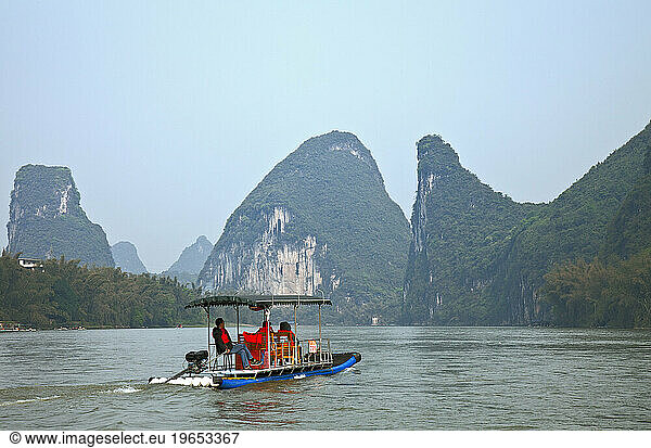 Small tourboat on Li River  Yangshuo  Guangxi  China