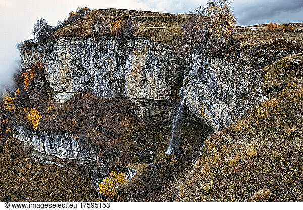 Small waterfall in North Caucasus during autumn