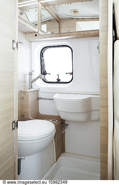 Small white bathroom inside motor home