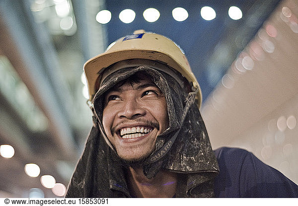 Smiling builder wearing a hardhat
