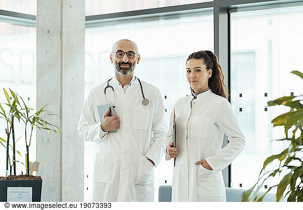 Smiling doctors standing together at hospital