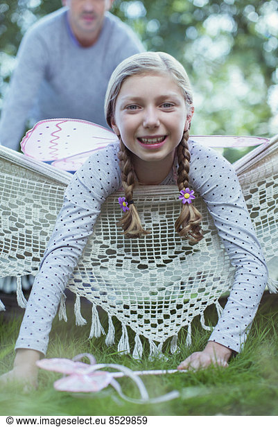 Smiling girl laying in hammock