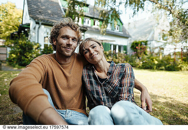Smiling man and woman together in garden