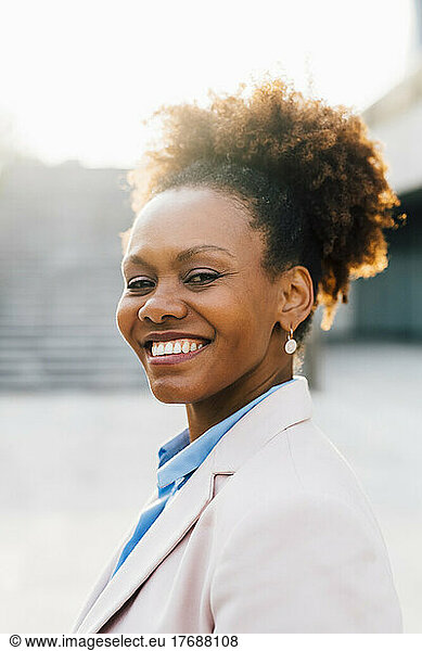 Smiling mature businesswoman with Afro hairstyle