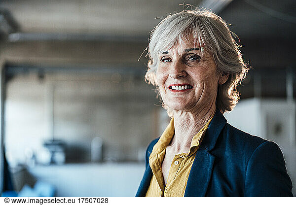 Smiling senior businesswoman at workplace