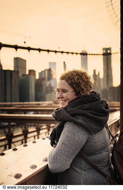 Smiling woman and skyscrapers in background