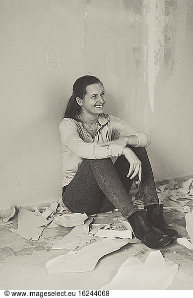 Smiling woman resting during house renovation