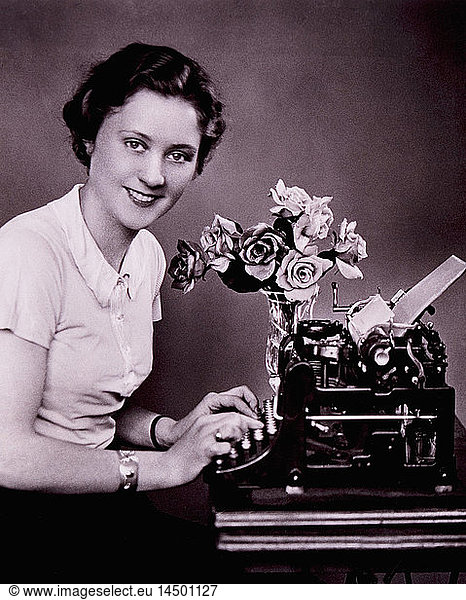 Smiling Woman Typing on Typewriter  1930's