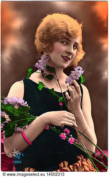 Smiling Woman with Red Hair Holding Flowers  Hand-Colored French Postcard  1927