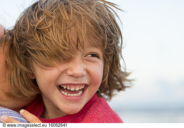 smiling 5 year old boy at the beach