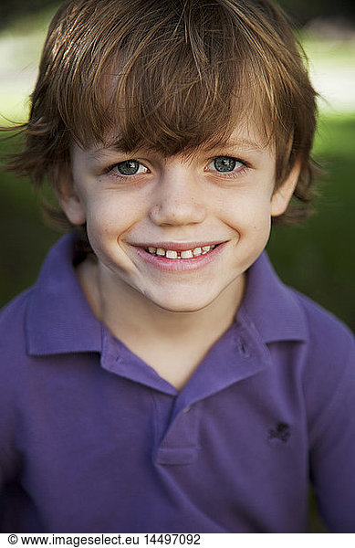 Smiling Young Boy With Blue Eyes