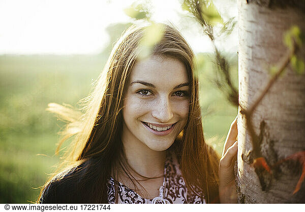 Smiling young woman enjoying nature