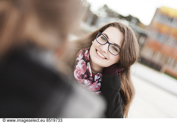 Smiling young woman outdoors