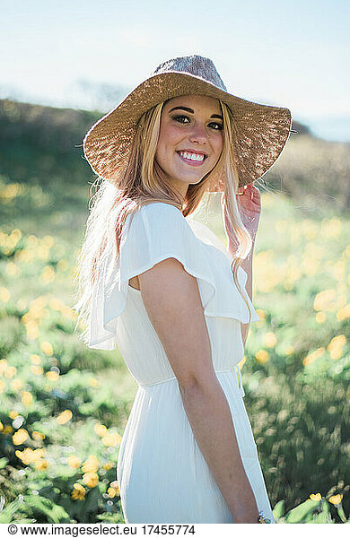 Smiling Young Woman 18-22 Years in Casual Dress and Sun Hat
