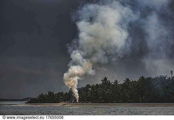 Smoke at tropical beach  Maldives
