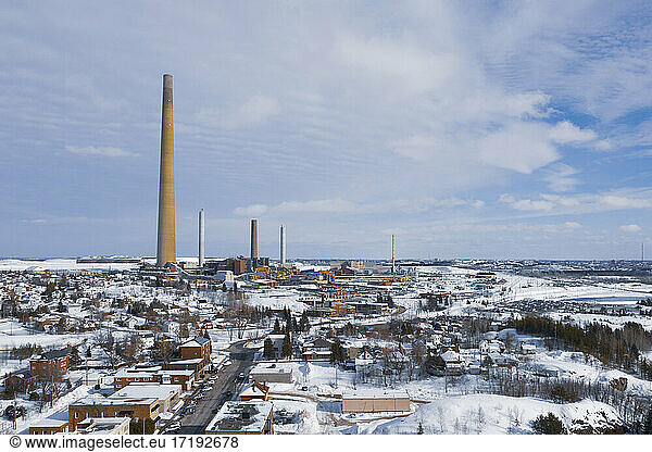 Smoke Stack Rises 1000 Ft. Over Wintery Town
