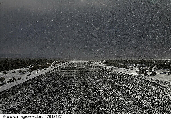 Snow blows across a wintery back road in Steens Mountain Wilderness in Oregon  USA; Burns  Oregon  United States of America