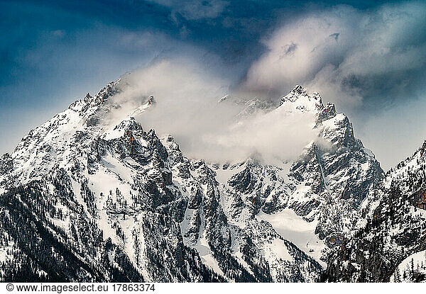 snow-capped grand teton mountain peak in winter