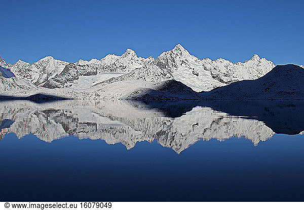 Snow-capped peaks and reflection  Valais Alps   Switzerland.